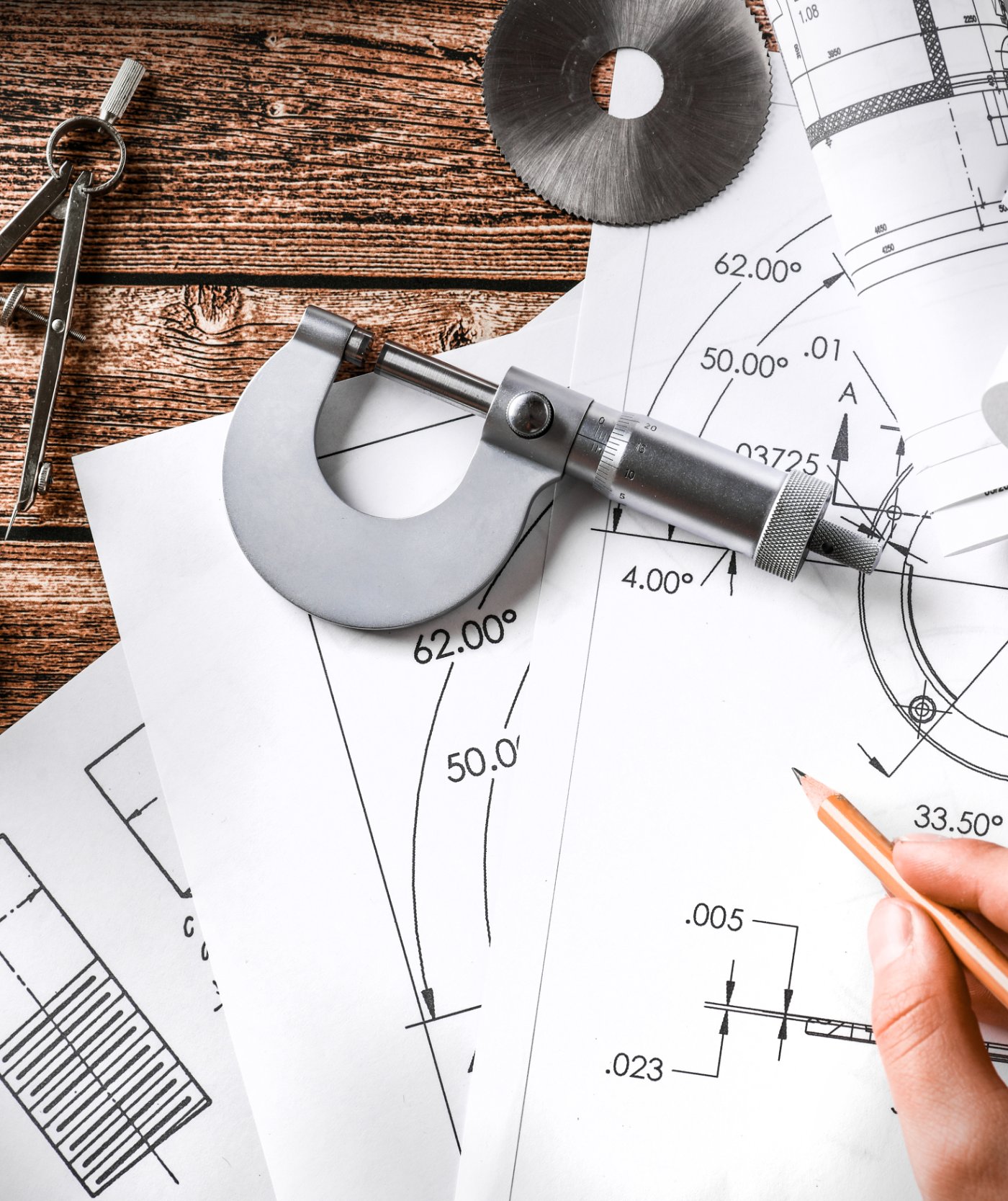 Manufacturing marketing agency reviewing engineering drawings and machined parts